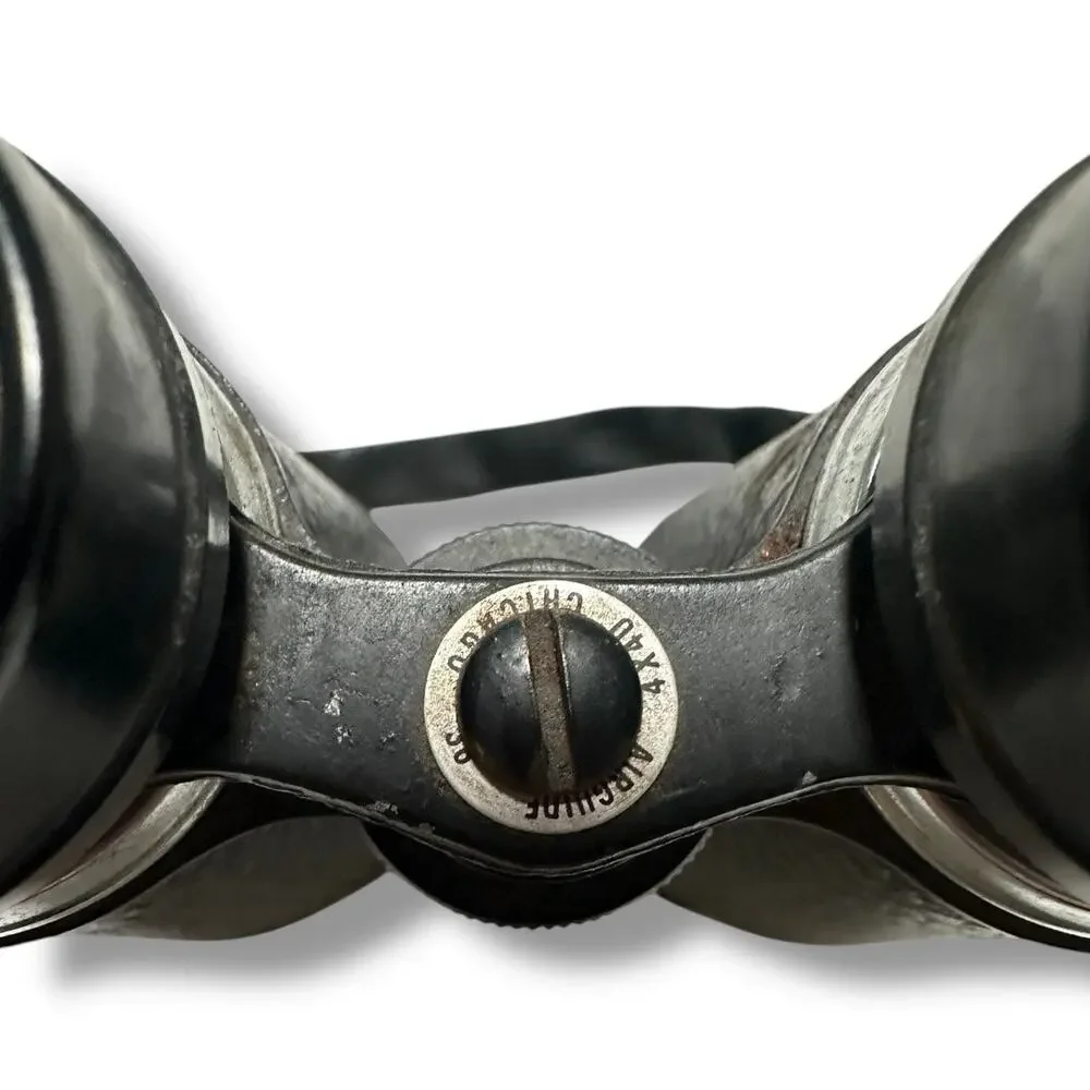 Compact Black Binoculars with Textured Grip and Central Hinge